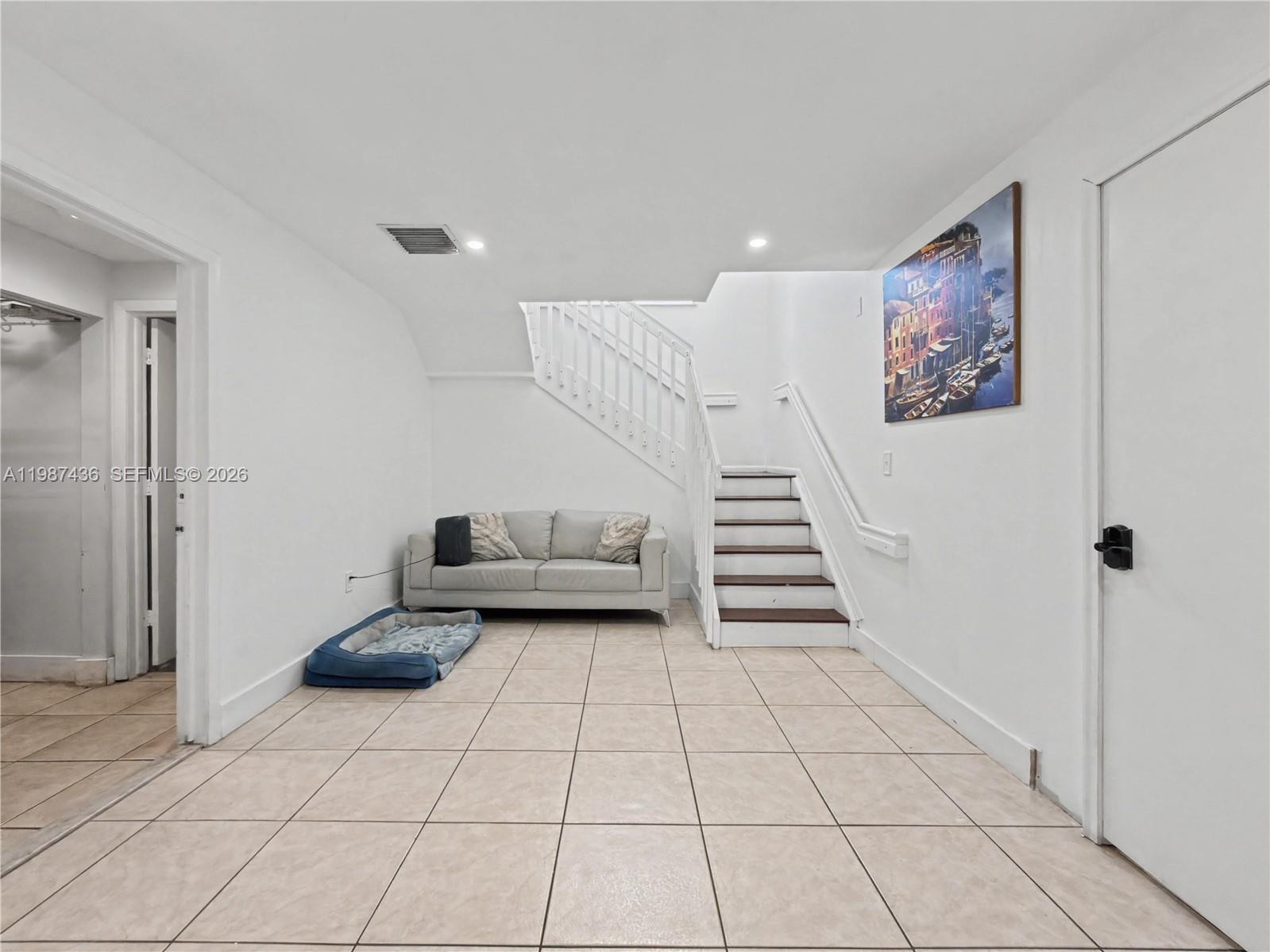 16004 Southwest 87th Terrace Miami, FL 33193 - Photo 11 of 30 a view of a livingroom with furniture and stairs
