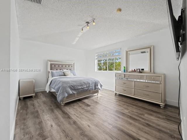 16004 Southwest 87th Terrace Miami, FL 33193 - Photo 13 of 30 a bedroom with a bed and a couch