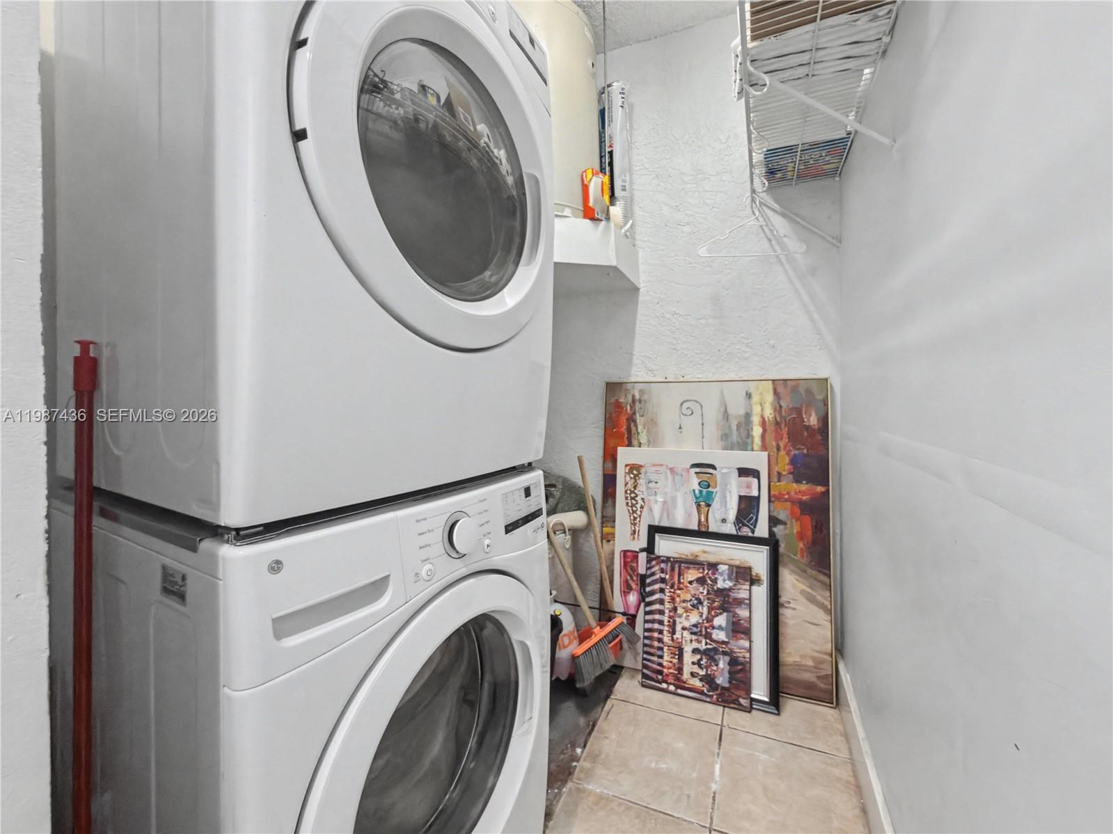 16004 Southwest 87th Terrace Miami, FL 33193 - Photo 24 of 30 a utility room with dryer and washer
