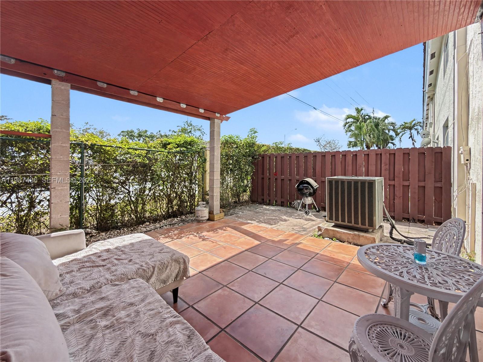 16004 Southwest 87th Terrace Miami, FL 33193 - Photo 26 of 30 a view of backyard with a patio