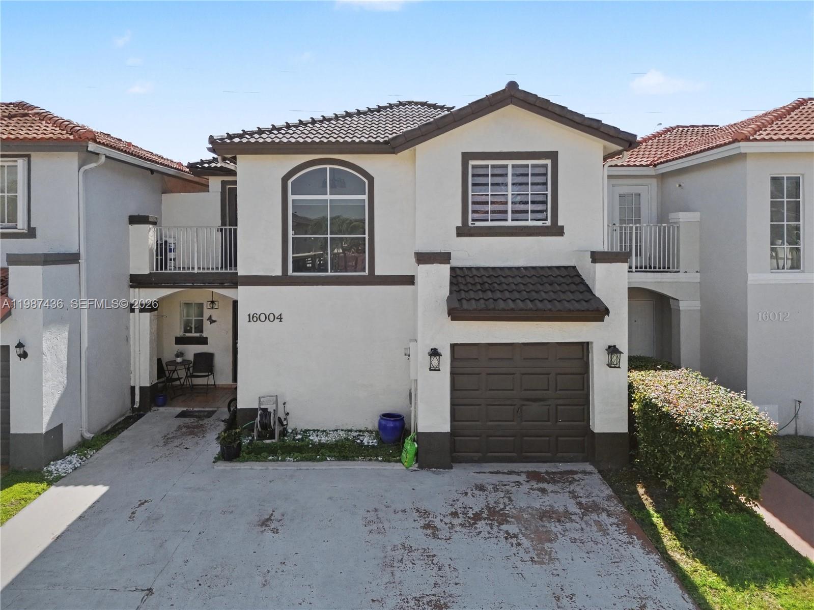 16004 Southwest 87th Terrace Miami, FL 33193 - Photo 28 of 30 a view of a house with a yard