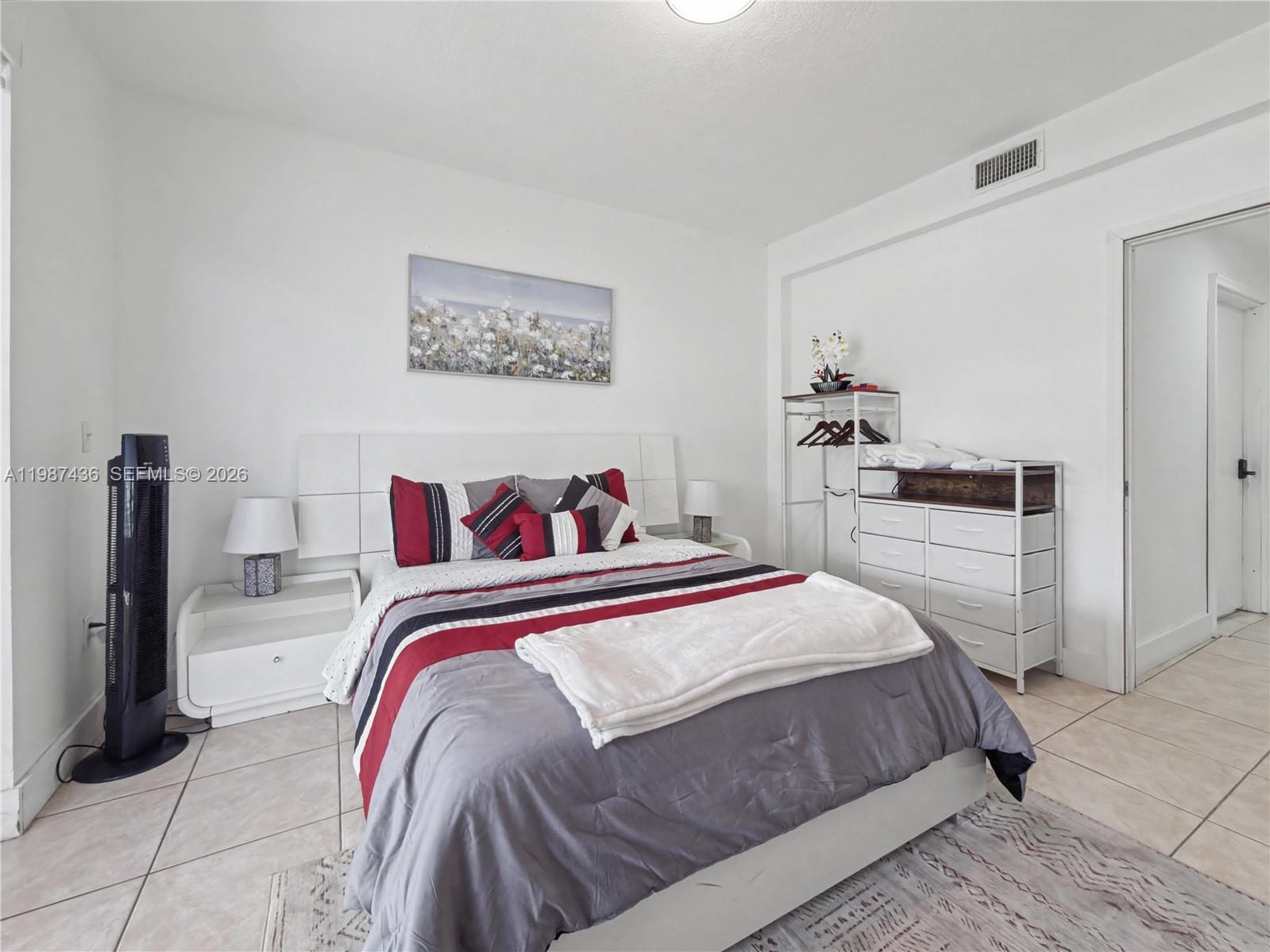 16004 Southwest 87th Terrace Miami, FL 33193 - Photo 7 of 30 a bedroom with a bed and a view of kitchen