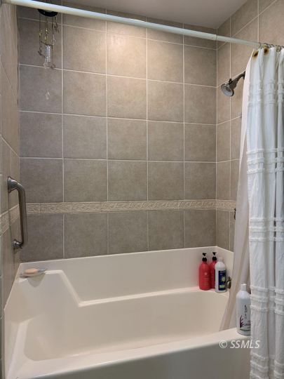 1320 Mayo Street Ridgecrest, CA 93555 - Photo 27 of 45 a bathroom with a bathtub and shower