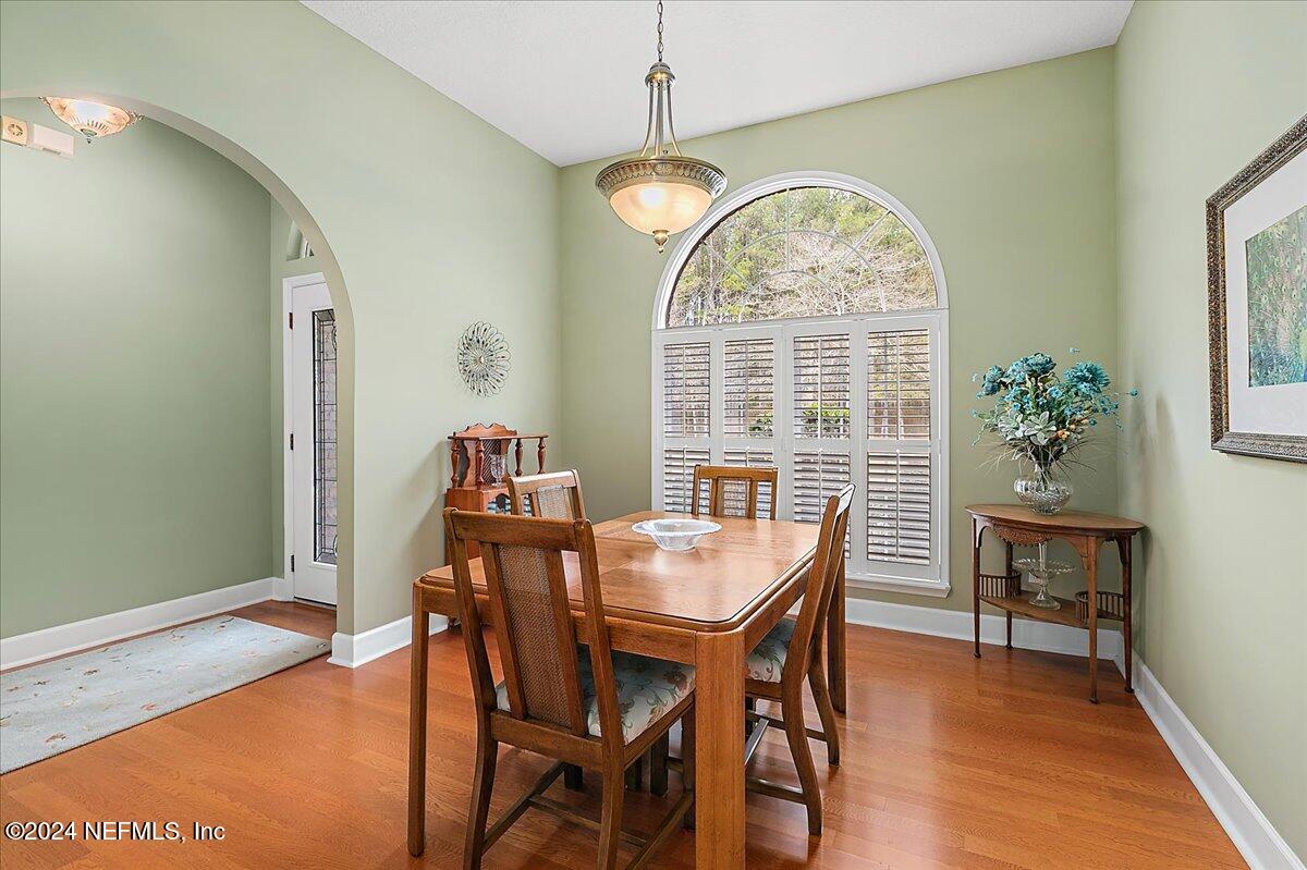9058 Butcher Road Glen St. Mary, FL 32040 - Photo 13 of 43 a view of a dining room with furniture window and wooden floor