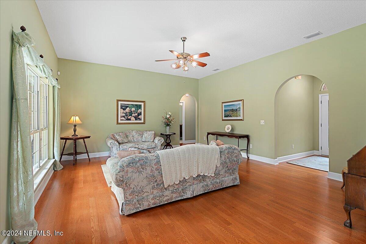 9058 Butcher Road Glen St. Mary, FL 32040 - Photo 14 of 43 a living room with furniture and a chandelier