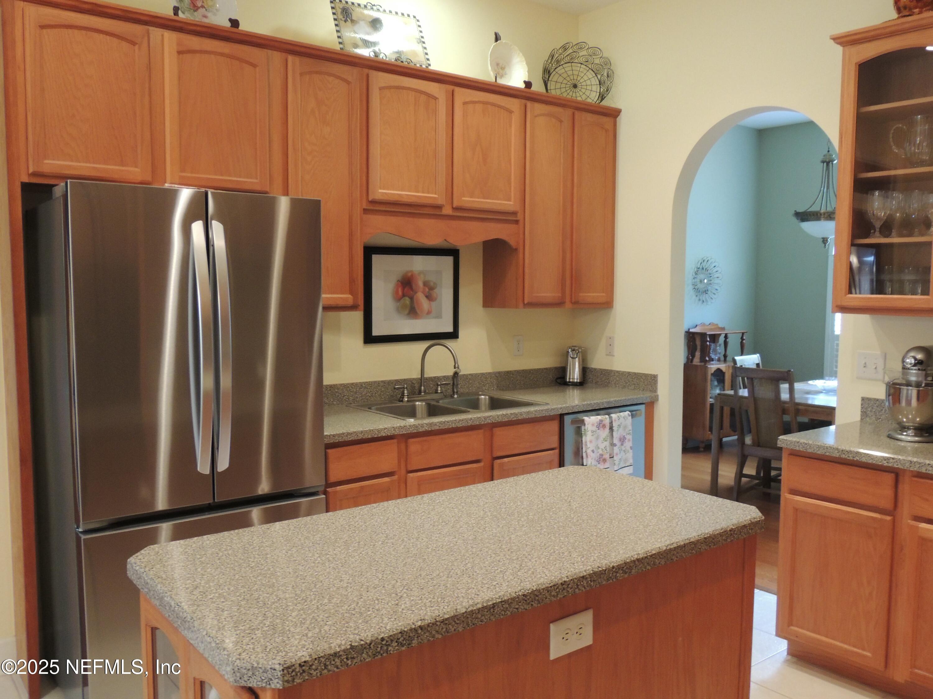 9058 Butcher Road Glen St. Mary, FL 32040 - Photo 15 of 43 a kitchen with stainless steel appliances granite countertop a refrigerator a sink a stove and a refrigerator