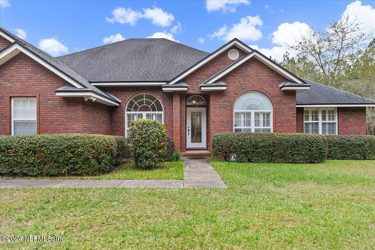 9058 Butcher Road Glen St. Mary, FL 32040 - Photo 2 of 43 a front view of a house with a yard