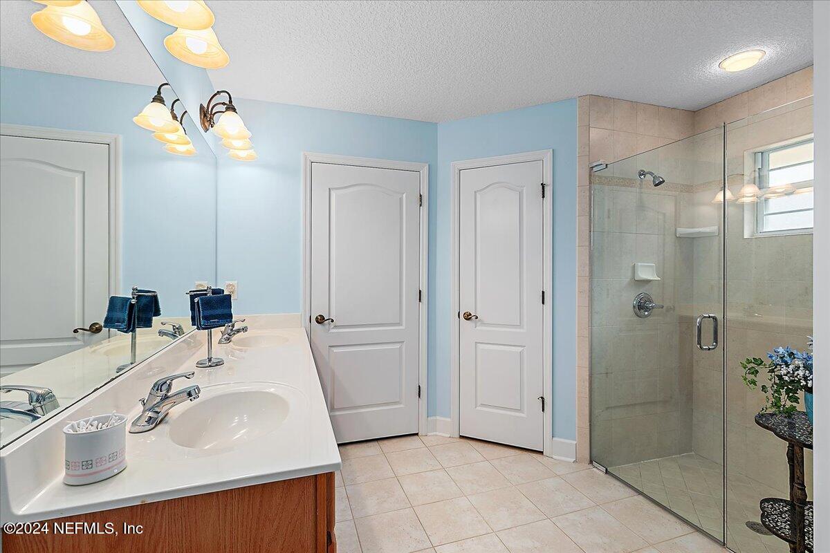 9058 Butcher Road Glen St. Mary, FL 32040 - Photo 21 of 43 a bathroom with a sink a toilet and shower