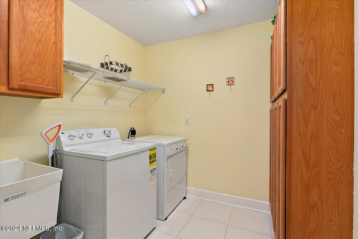 9058 Butcher Road Glen St. Mary, FL 32040 - Photo 25 of 43 a utility room with dryer and washer