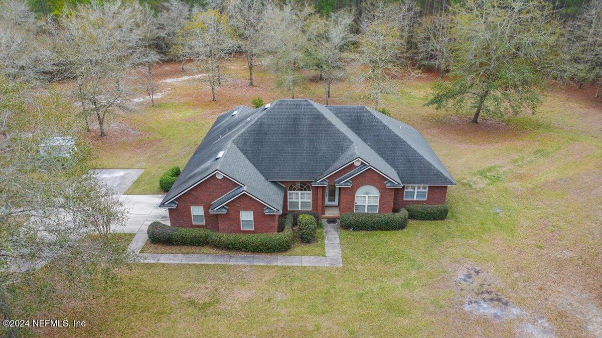 9058 Butcher Road Glen St. Mary, FL 32040 - Photo 7 of 43 a house with river in front of it