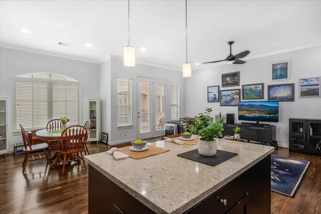 a kitchen with a table a sink and cabinets