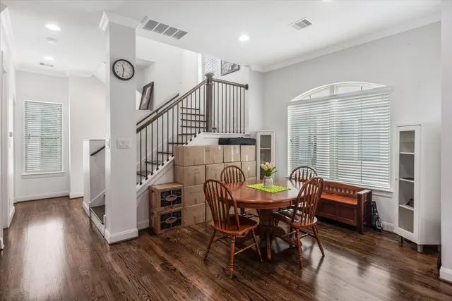 a view of a dining room with furniture and wooden floor