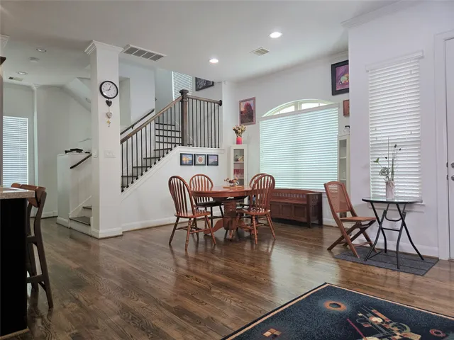 a view of a dining room with furniture window and wooden floor