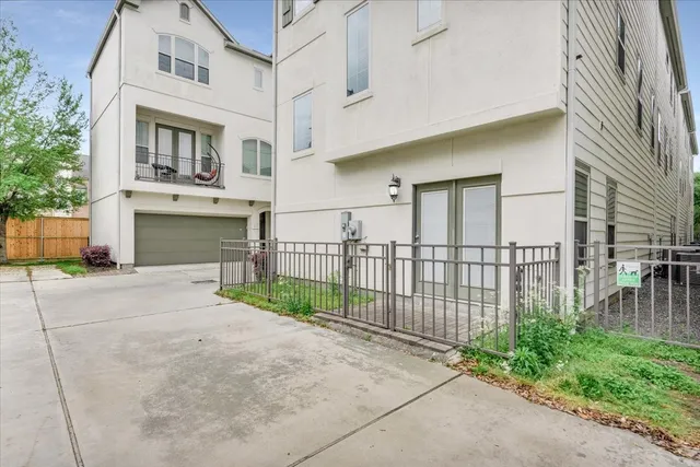 a view of a brick house with many windows