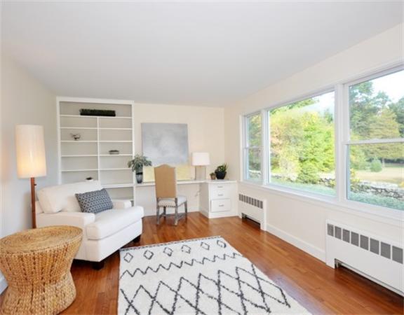 292 Musketaquid Road Concord, MA 01742 - Photo 11 of 28 a living room with furniture and a large window
