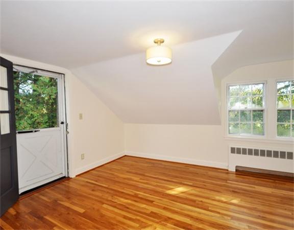 292 Musketaquid Road Concord, MA 01742 - Photo 18 of 28 an empty room with wooden floor and windows