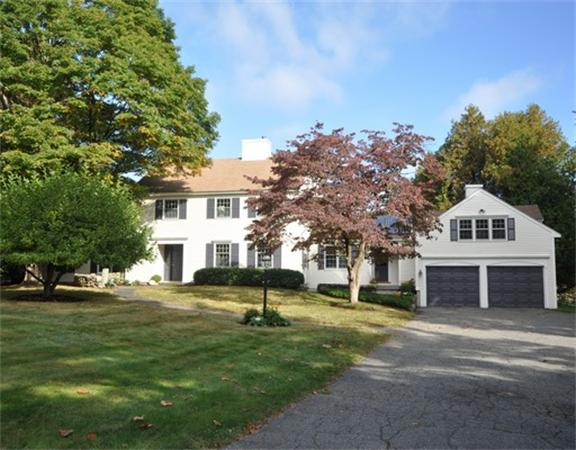 292 Musketaquid Road Concord, MA 01742 - Photo 24 of 28 a view of a big house with a big yard and large trees
