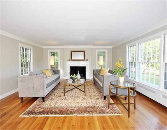 292 Musketaquid Road Concord, MA 01742 - Photo 4 of 28 a living room with furniture and a fireplace