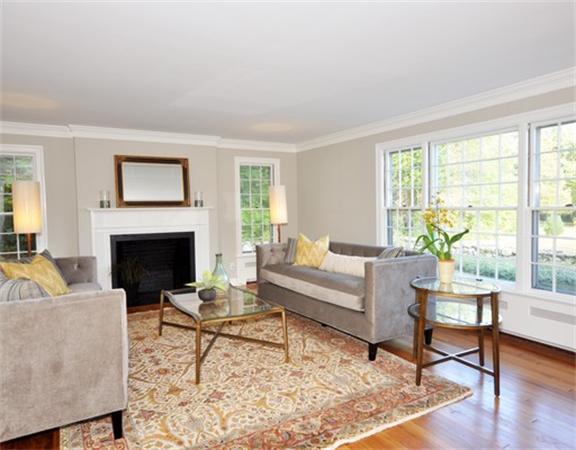 292 Musketaquid Road Concord, MA 01742 - Photo 5 of 28 a living room with furniture a rug a window and a fireplace