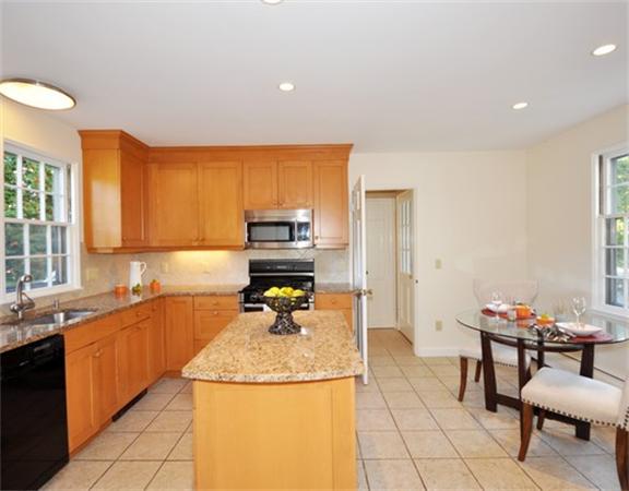 292 Musketaquid Road Concord, MA 01742 - Photo 8 of 28 a kitchen with a sink and a stove top oven