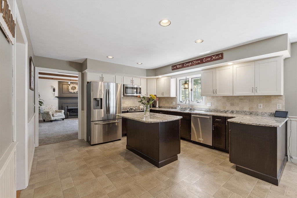 4 Ridge Road Pepperell, MA 01463 - Photo 9 of 42 a kitchen with stainless steel appliances granite countertop a refrigerator and a sink
