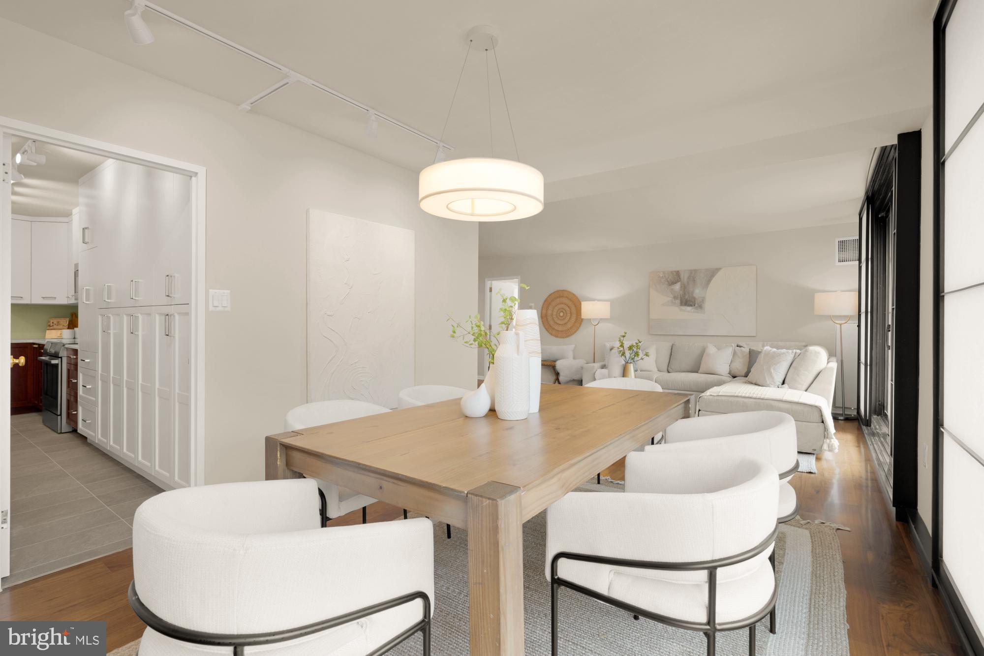 2555 Pennsylvania Avenue Northwest, Unit 617 & 618 Washington, DC 20037 - Photo 16 of 56 a view of a dining room with furniture and wooden floor