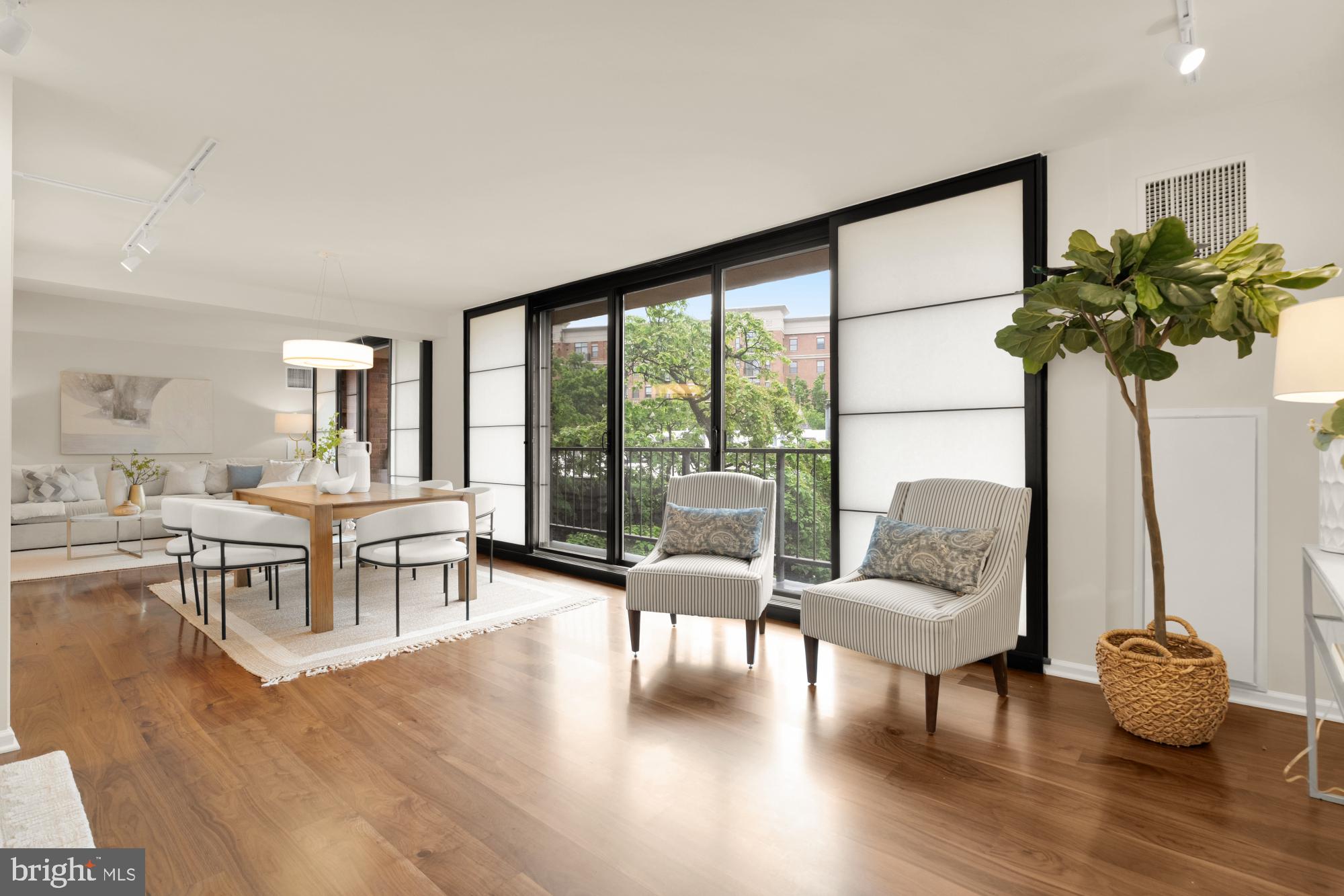 2555 Pennsylvania Avenue Northwest, Unit 617 & 618 Washington, DC 20037 - Photo 18 of 56 a living room with furniture and a potted plant
