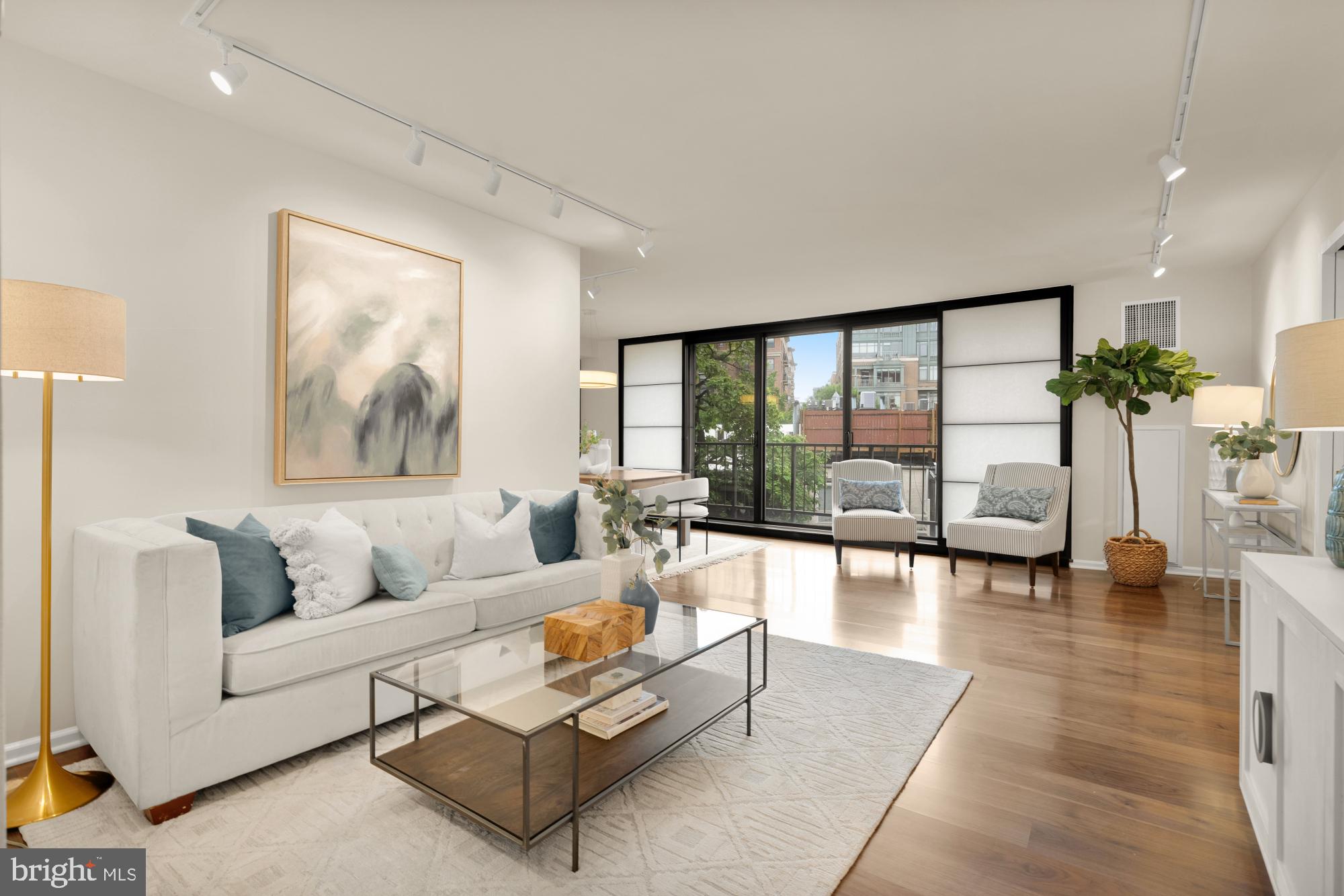 2555 Pennsylvania Avenue Northwest, Unit 617 & 618 Washington, DC 20037 - Photo 19 of 56 a living room with furniture and a large window