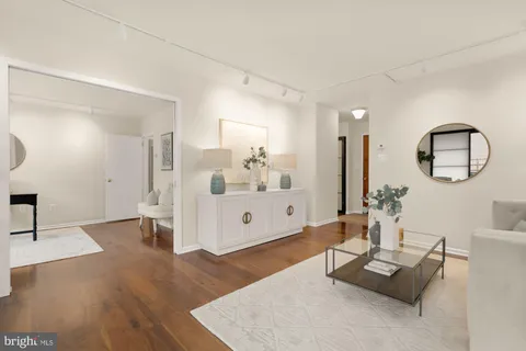 a kitchen with stainless steel appliances white cabinets and a stove