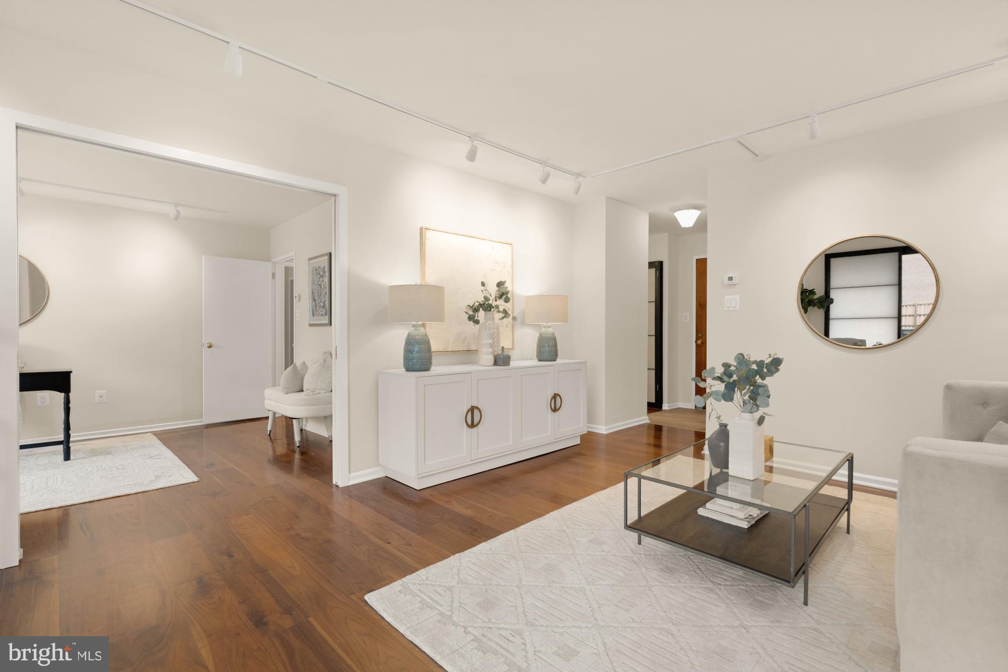 2555 Pennsylvania Avenue Northwest, Unit 617 & 618 Washington, DC 20037 - Photo 22 of 56 a living room with furniture and a wooden floor
