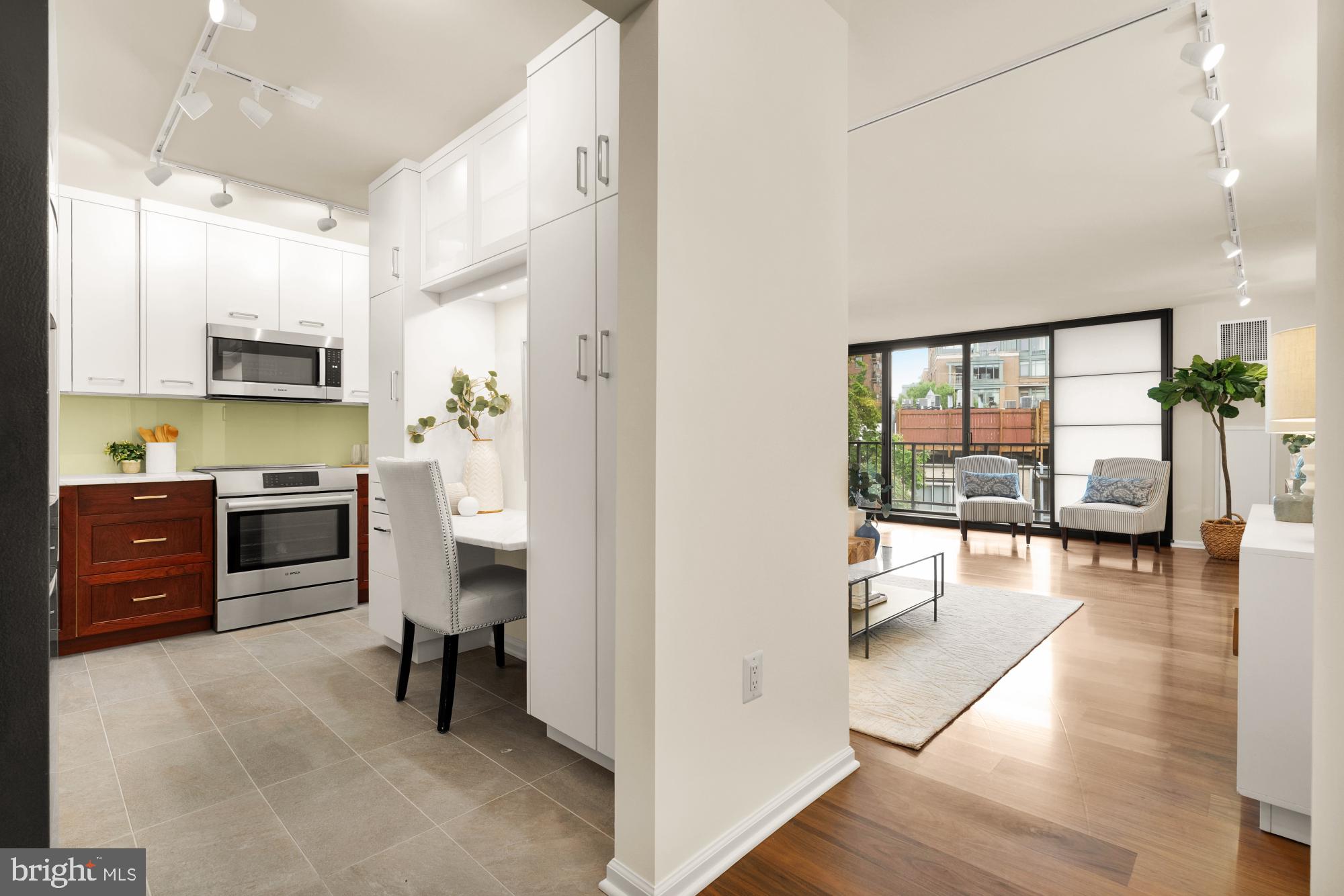 2555 Pennsylvania Avenue Northwest, Unit 617 & 618 Washington, DC 20037 - Photo 24 of 56 a view of kitchen with kitchen island wooden floor and living room