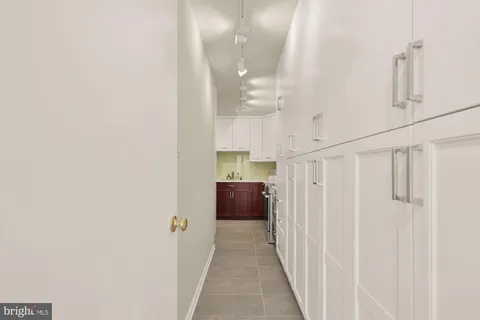 a large white bed in a white room