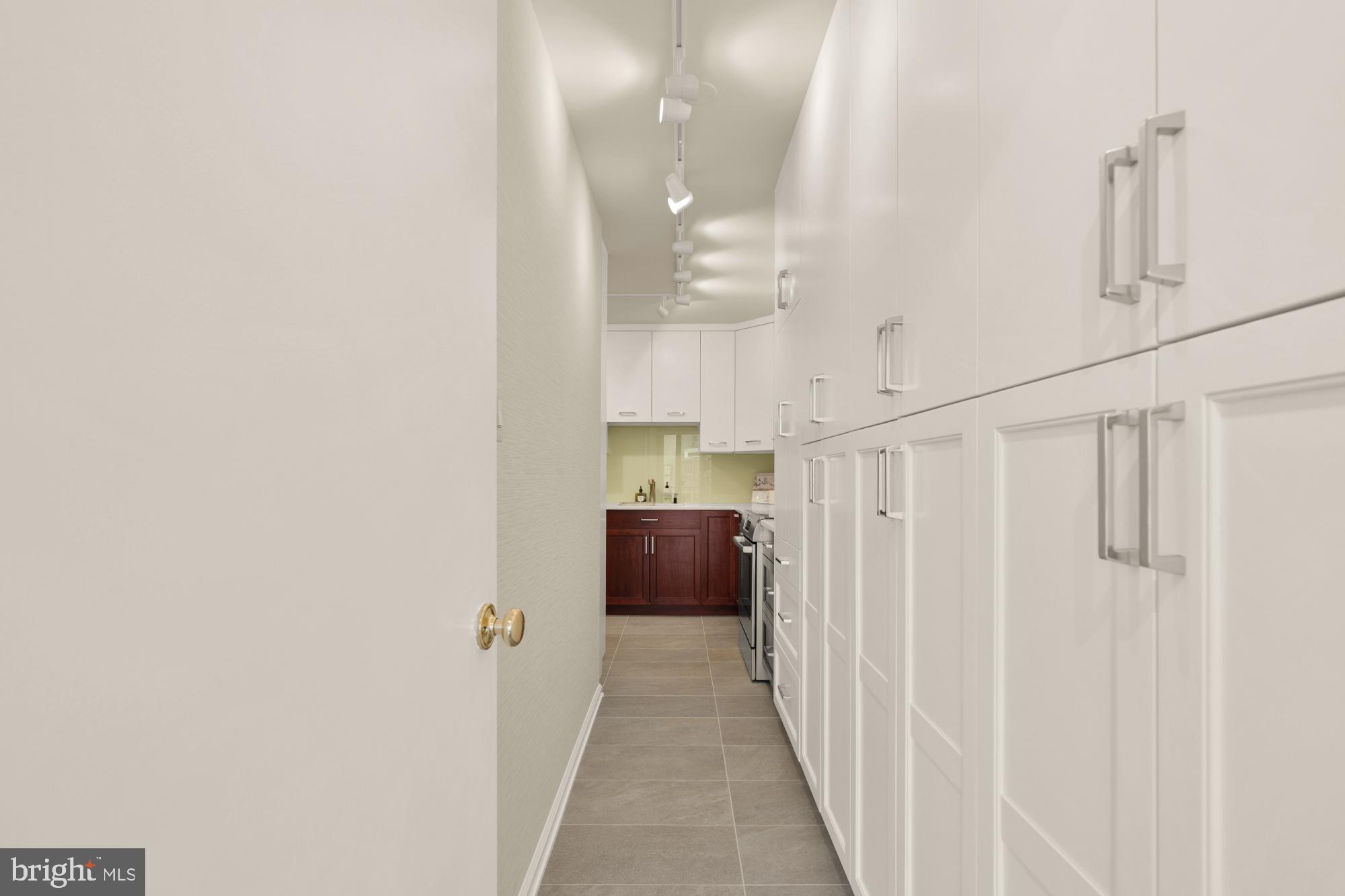 2555 Pennsylvania Avenue Northwest, Unit 617 & 618 Washington, DC 20037 - Photo 28 of 56 a view of a hallway with a furniture