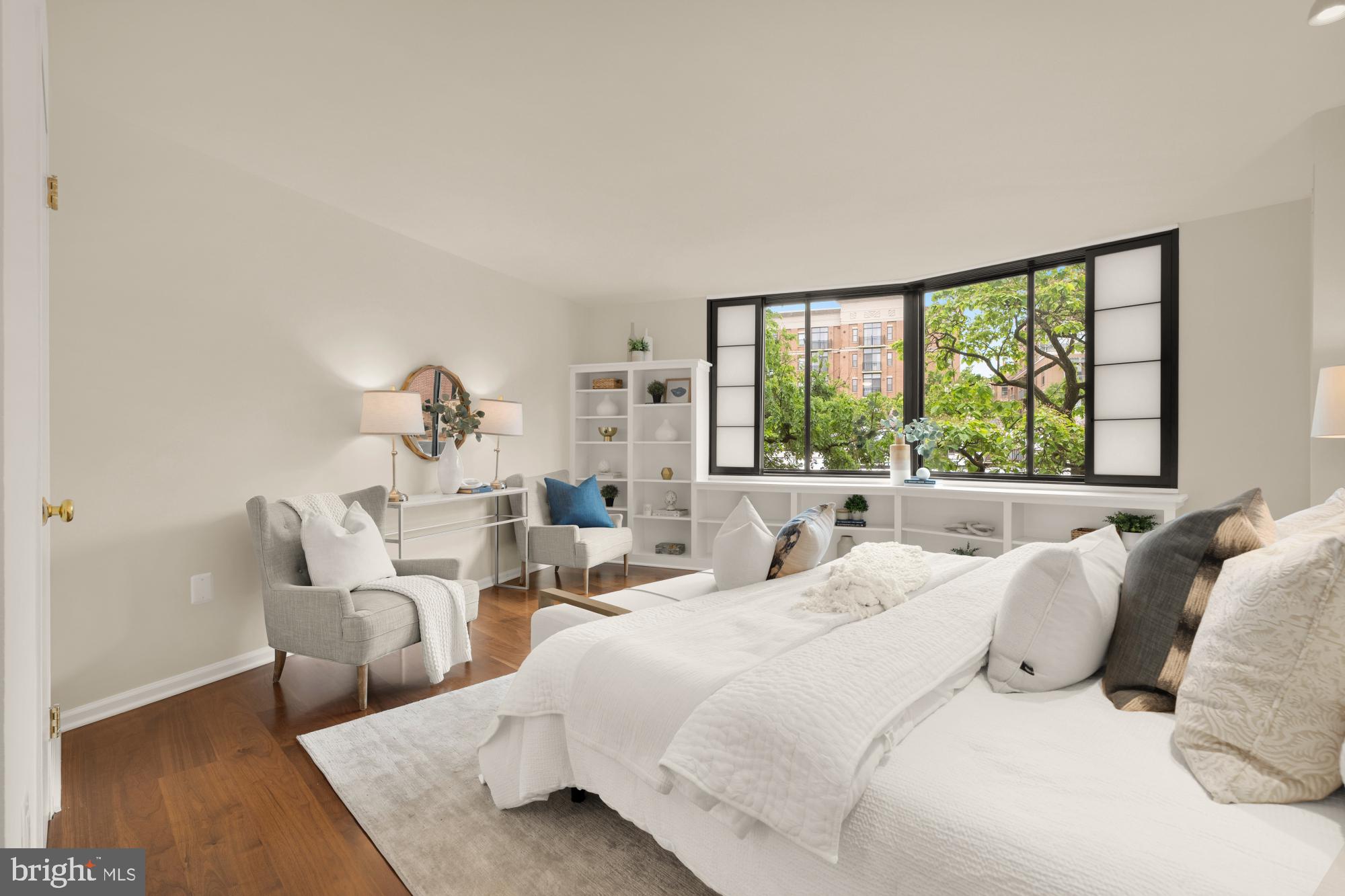 2555 Pennsylvania Avenue Northwest, Unit 617 & 618 Washington, DC 20037 - Photo 29 of 56 a bedroom with bed and large windows