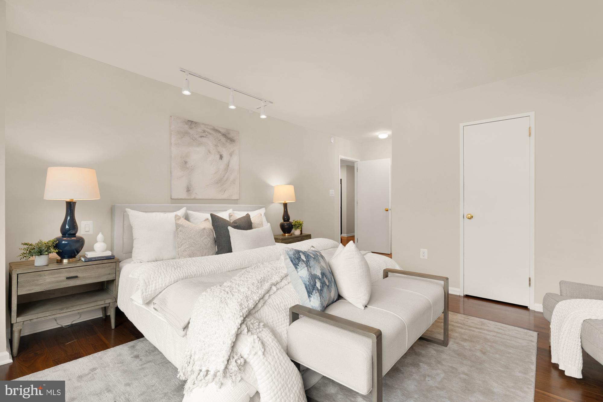 2555 Pennsylvania Avenue Northwest, Unit 617 & 618 Washington, DC 20037 - Photo 30 of 56 a spacious bedroom with a bed and a couch