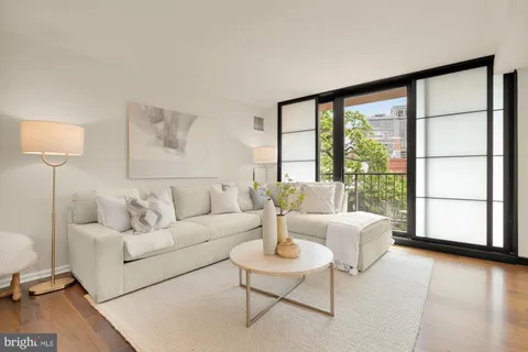 a view of a dining room with furniture and window