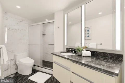 a spacious bedroom with a bed and a couch