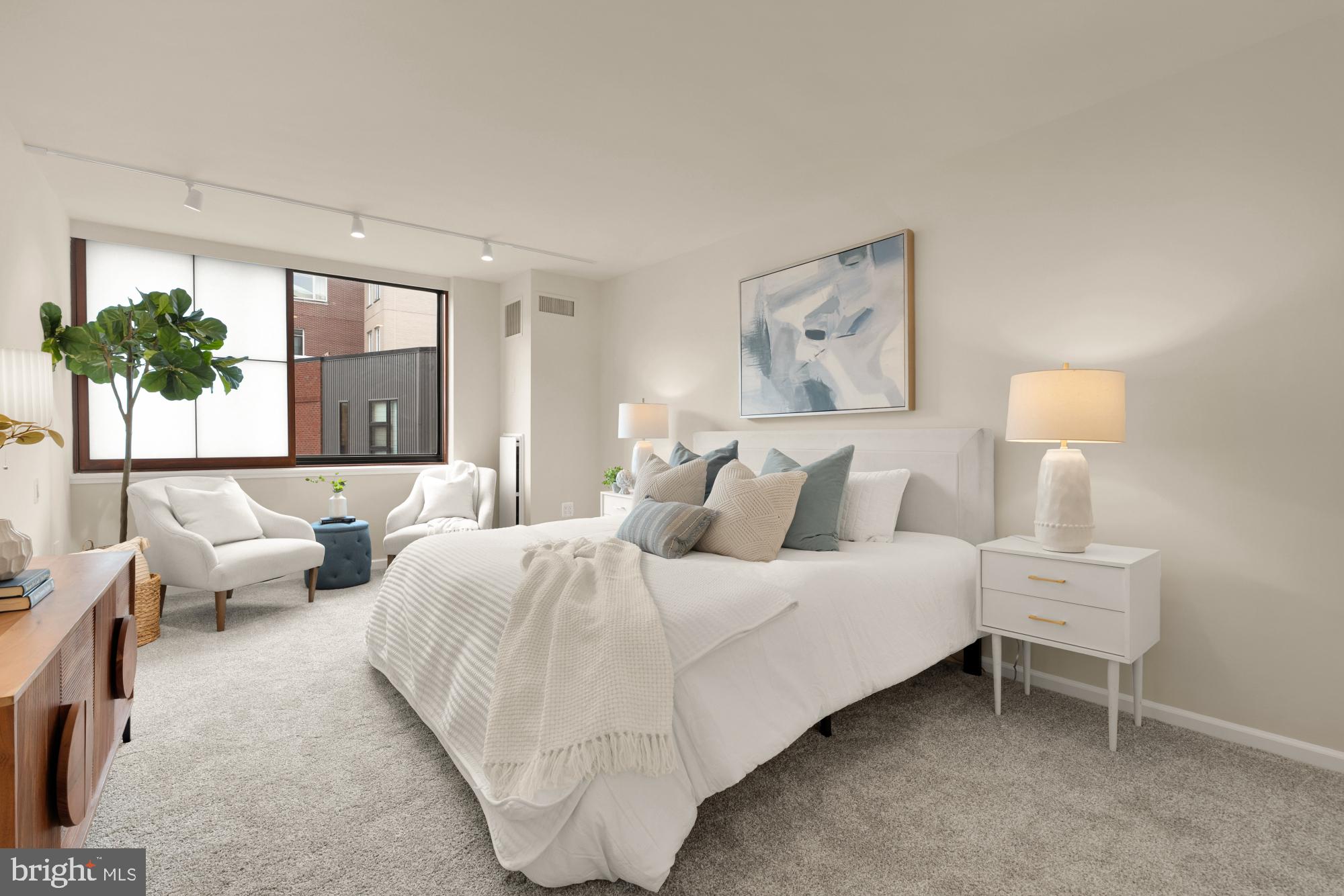 2555 Pennsylvania Avenue Northwest, Unit 617 & 618 Washington, DC 20037 - Photo 35 of 56 a spacious bedroom with a bed and a couch