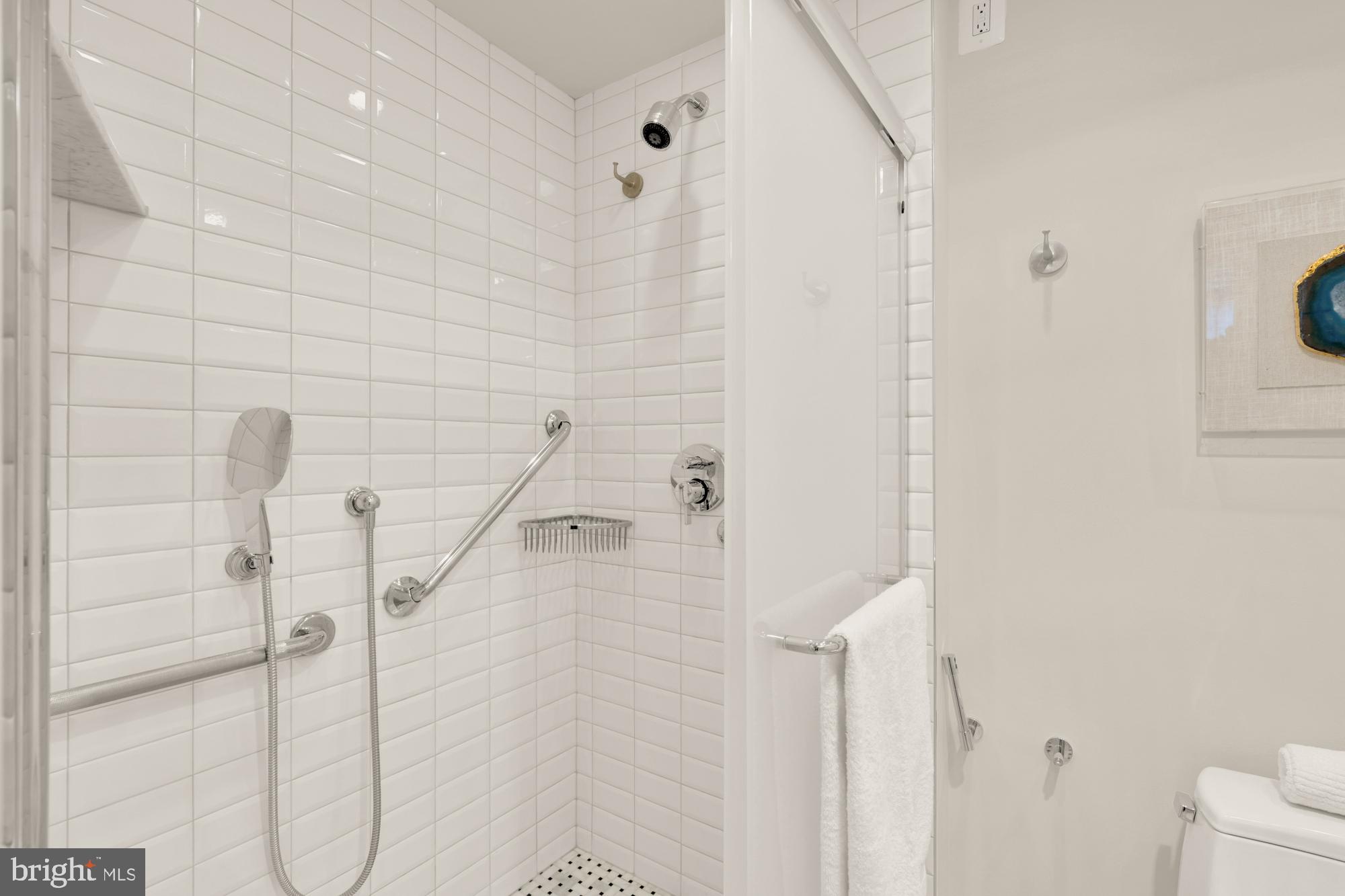 2555 Pennsylvania Avenue Northwest, Unit 617 & 618 Washington, DC 20037 - Photo 40 of 56 a bathroom with a shower