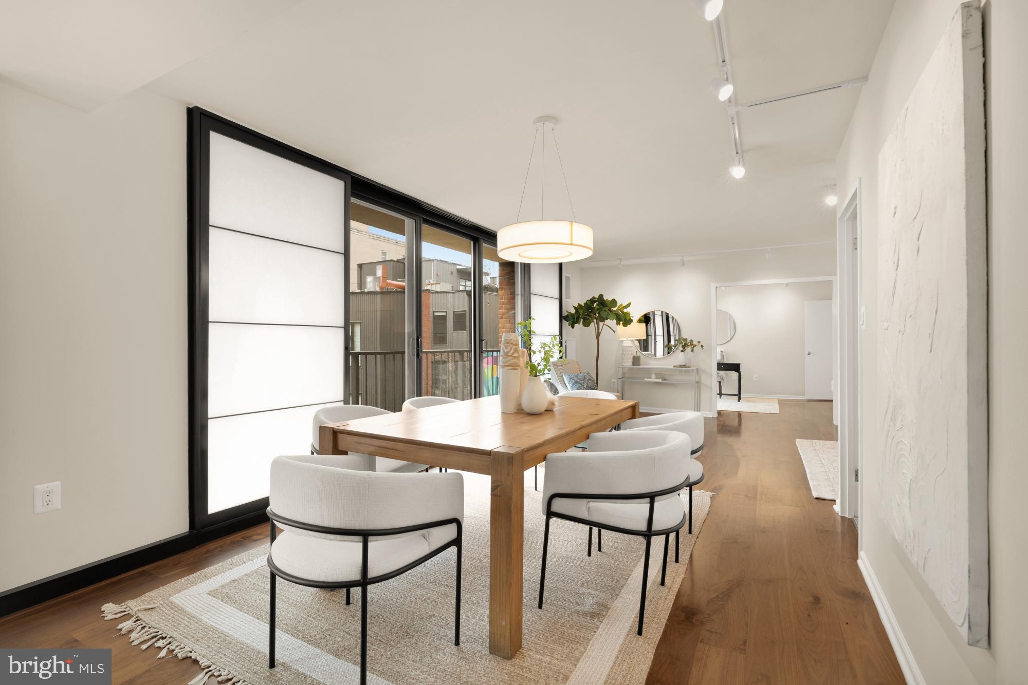 2555 Pennsylvania Avenue Northwest, Unit 617 & 618 Washington, DC 20037 - Photo 4 of 56 a view of a dining room with furniture and window