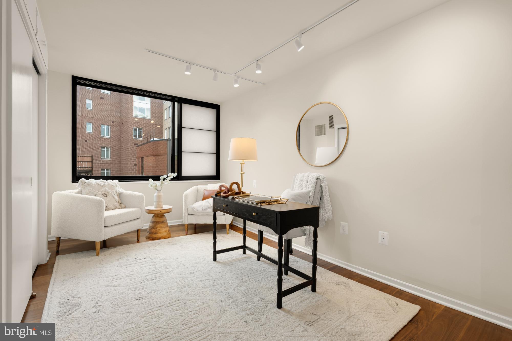 2555 Pennsylvania Avenue Northwest, Unit 617 & 618 Washington, DC 20037 - Photo 41 of 56 a living room with furniture a large window and a potted plant