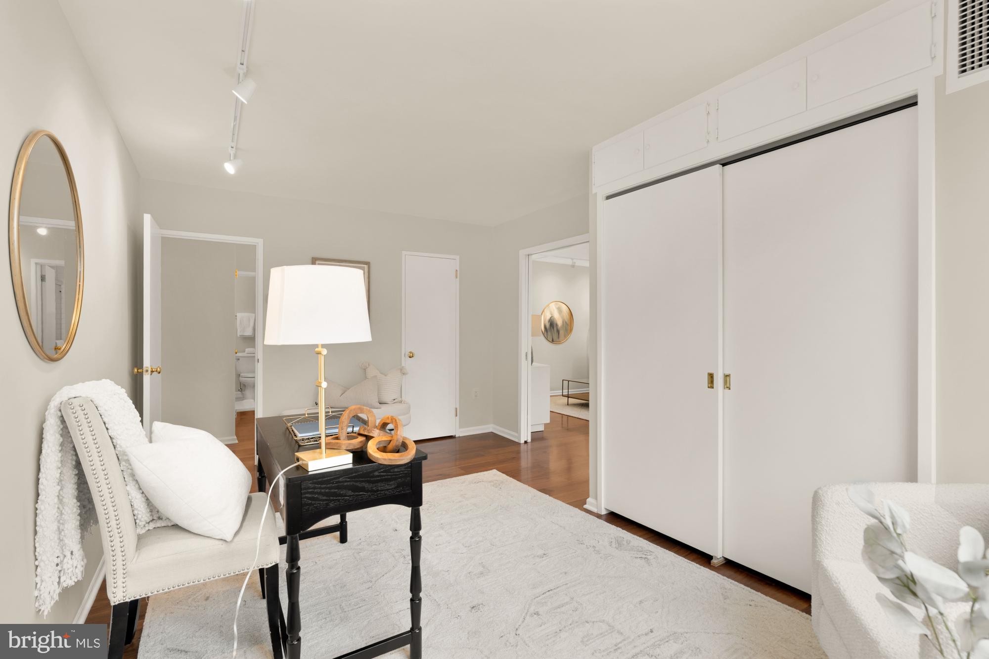 2555 Pennsylvania Avenue Northwest, Unit 617 & 618 Washington, DC 20037 - Photo 42 of 56 a living room with furniture a mirror and a table