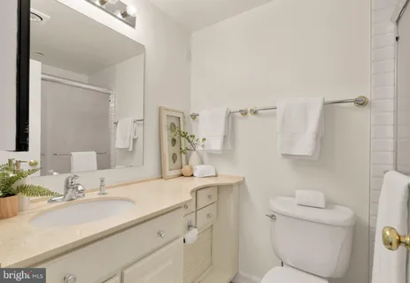 a view of a balcony with floor to ceiling windows with wooden floor