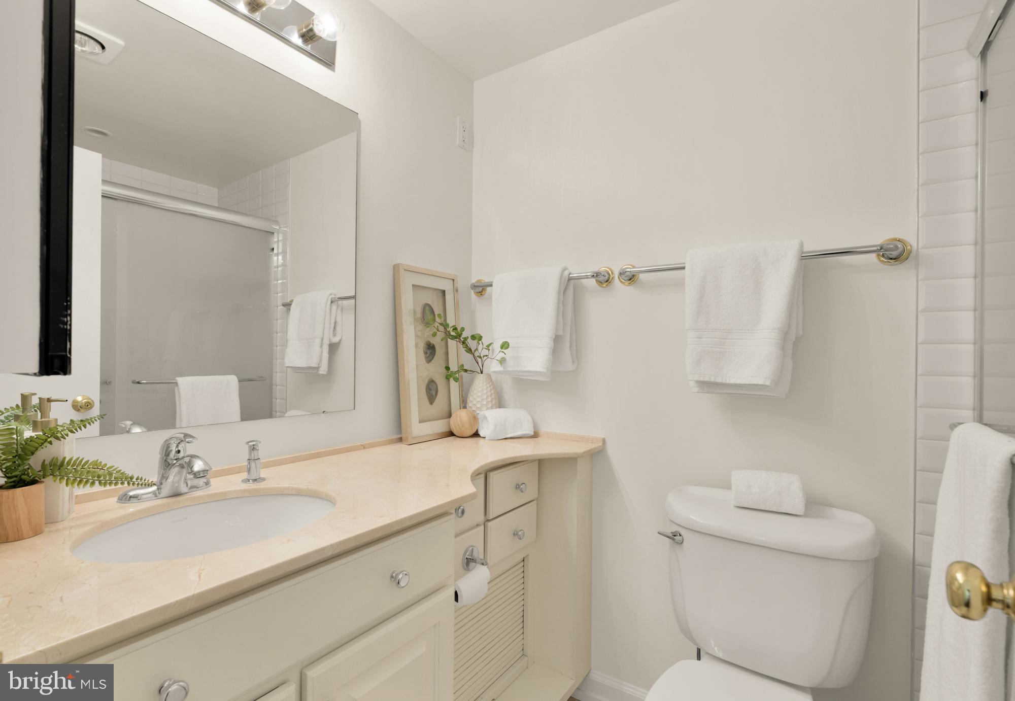 2555 Pennsylvania Avenue Northwest, Unit 617 & 618 Washington, DC 20037 - Photo 43 of 56 a bathroom with a sink toilet and shower