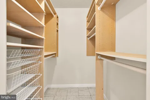 a balcony view with couple of chairs and wooden floor