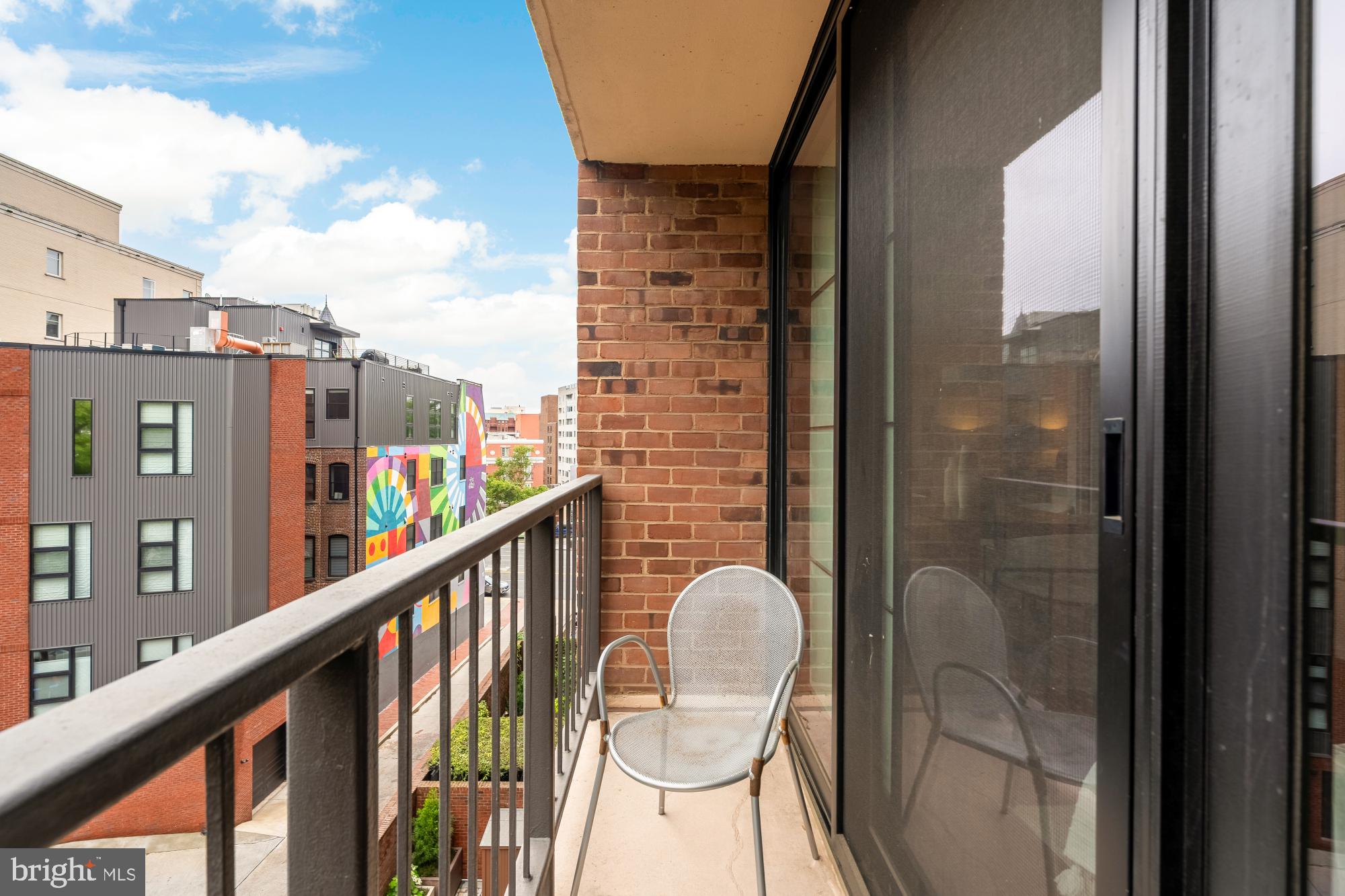 2555 Pennsylvania Avenue Northwest, Unit 617 & 618 Washington, DC 20037 - Photo 48 of 56 a balcony view with couple of chairs and wooden floor