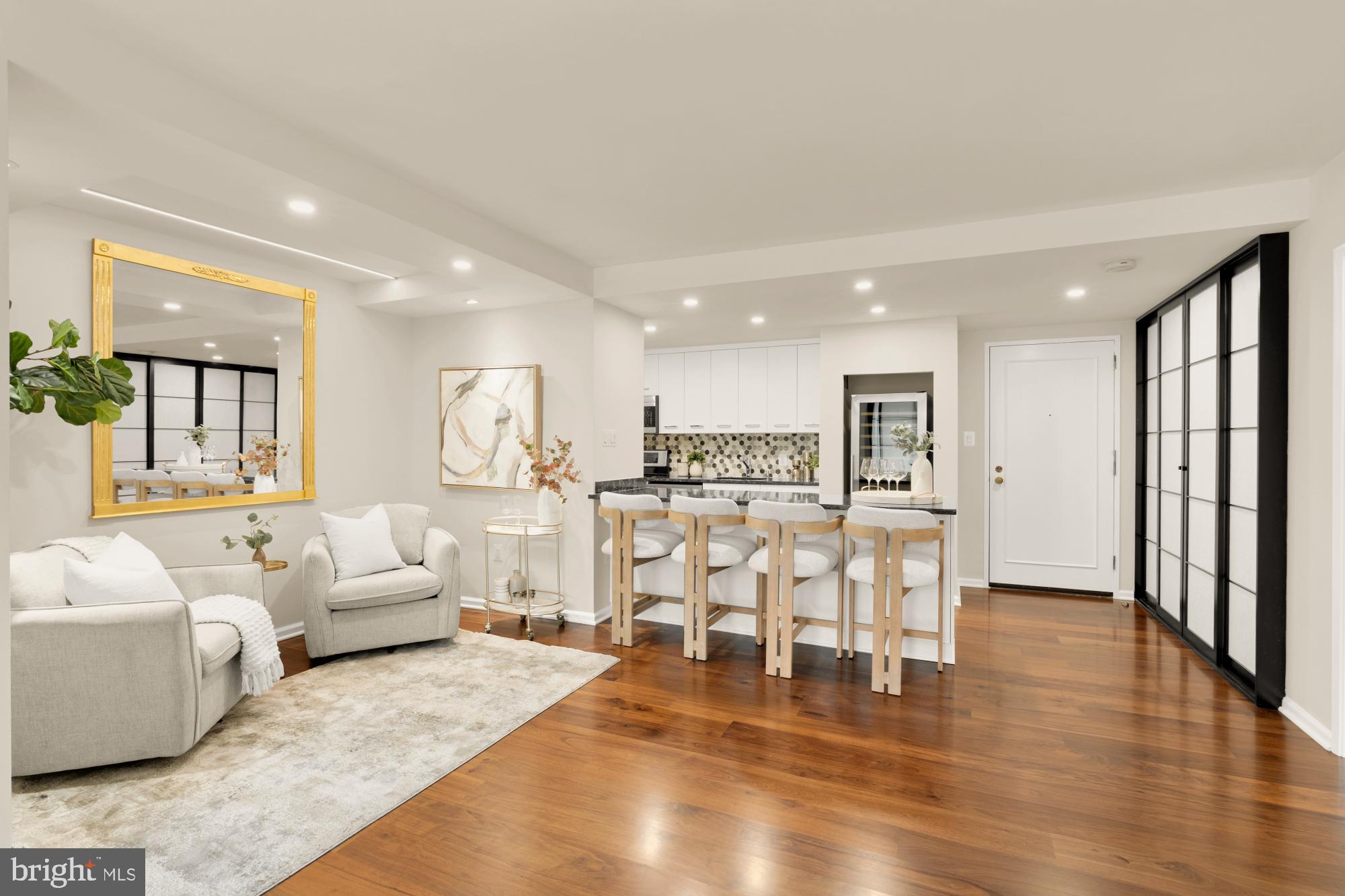 2555 Pennsylvania Avenue Northwest, Unit 617 & 618 Washington, DC 20037 - Photo 6 of 56 a living room with furniture and a dining table with wooden floor