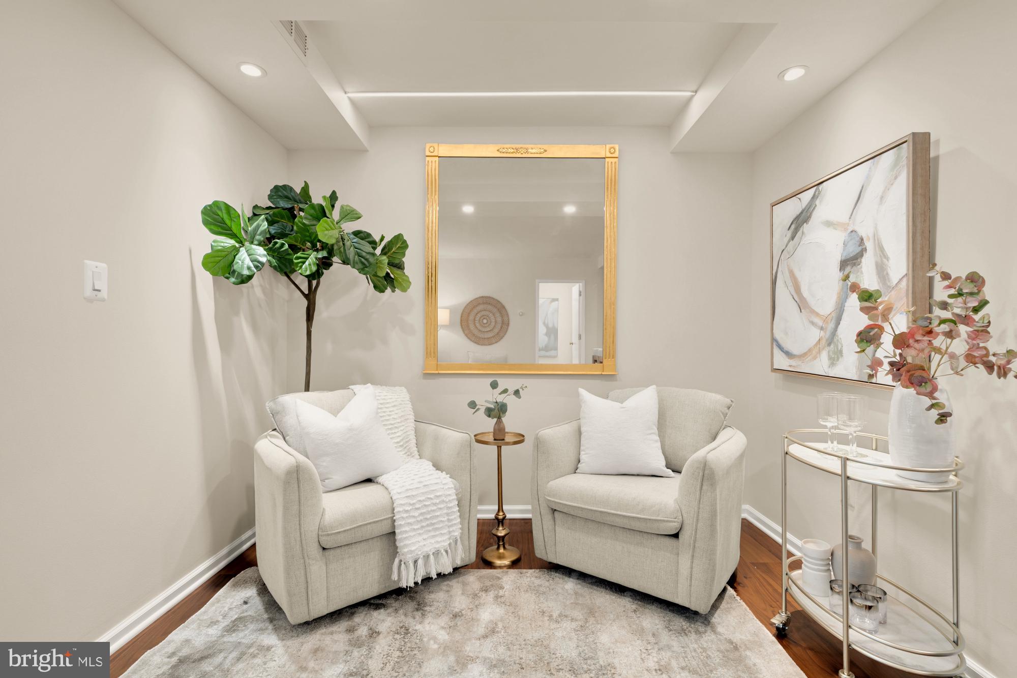 2555 Pennsylvania Avenue Northwest, Unit 617 & 618 Washington, DC 20037 - Photo 7 of 56 a living room with furniture and a potted plant