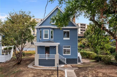 a front view of a house with garden