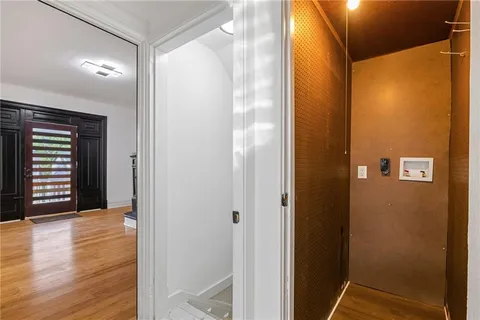 a view of front door with wooden floor